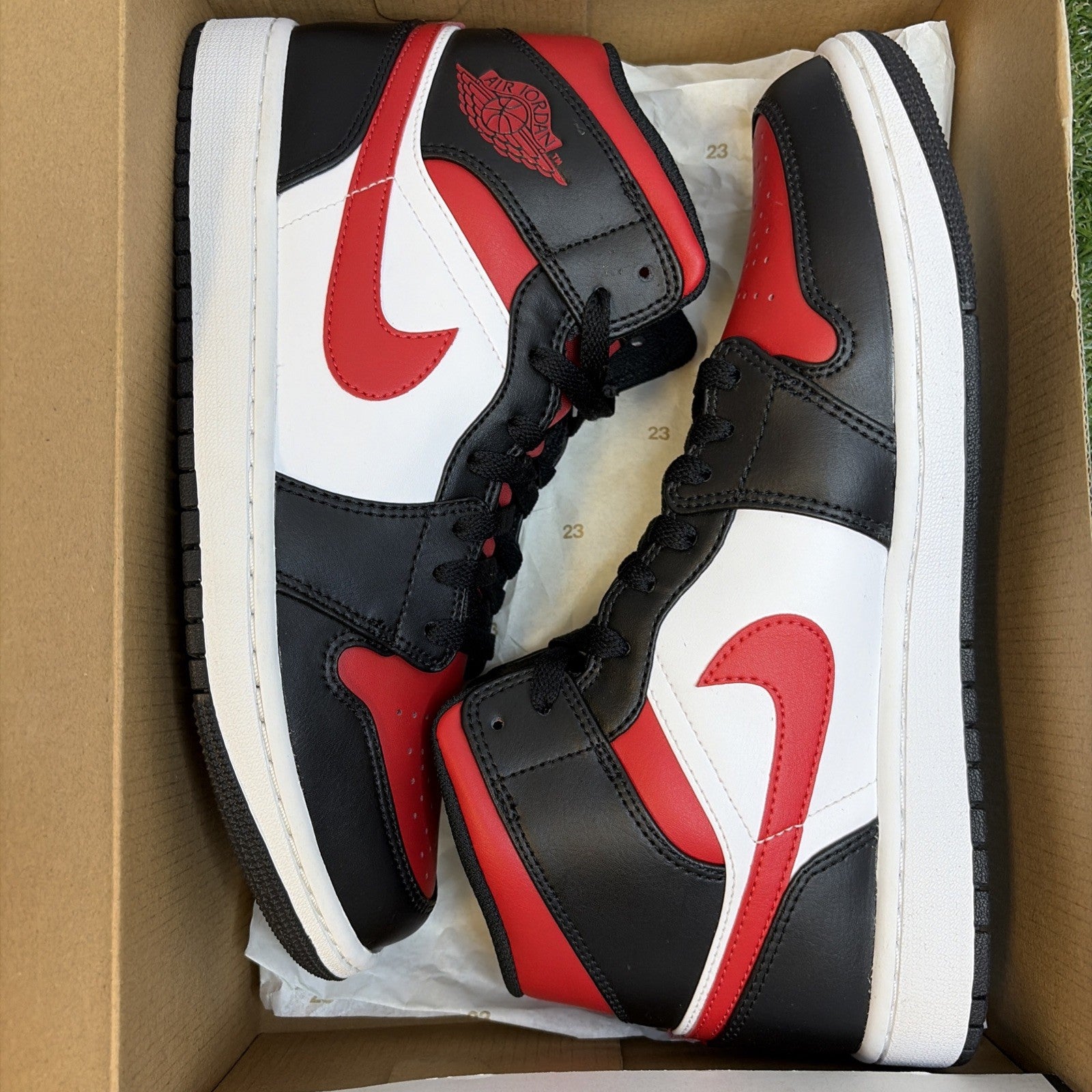 Size 9.5- Jordan Air Jordan 1 Mid Bred Toe Black/White/Fire Red 554724-0790